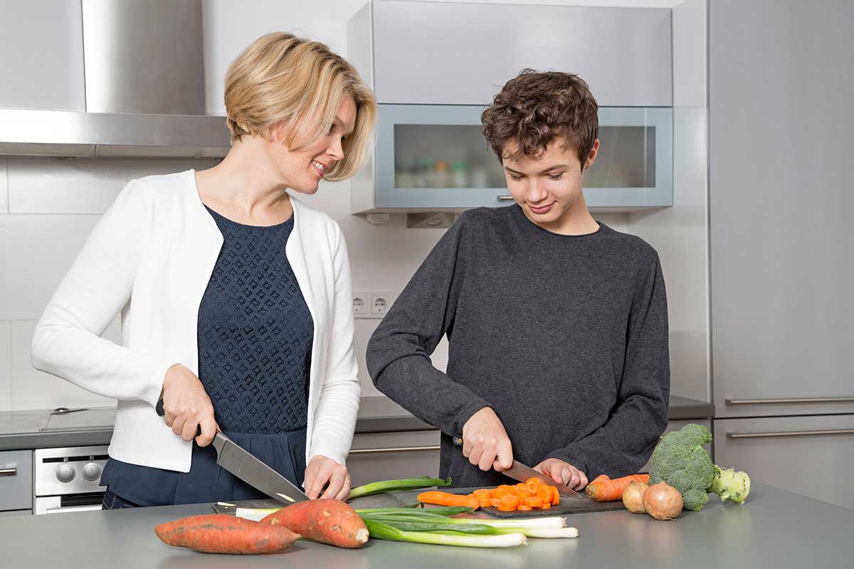 Mother and son in kitchen